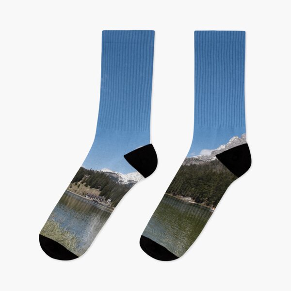 Item preview, The fabulous alpine lake of Misurina in the Dolomites. Boat on the water. Lovely and relaxing place in the Italian Alps. Reflections in the rippled water. Sunny spring day. designed and sold by Maurizio Fabbroni.