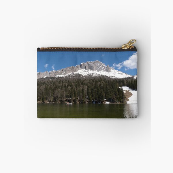 Item preview, The fabulous alpine lake of Misurina in the Dolomites. Boat on the water. Lovely and relaxing place in the Italian Alps. Reflections in the rippled water. Sunny spring day. designed and sold by Maurizio Fabbroni.