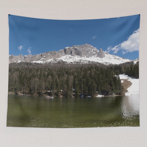 Item preview, The fabulous alpine lake of Misurina in the Dolomites. Boat on the water. Lovely and relaxing place in the Italian Alps. Reflections in the rippled water. Sunny spring day. designed and sold by Maurizio Fabbroni.