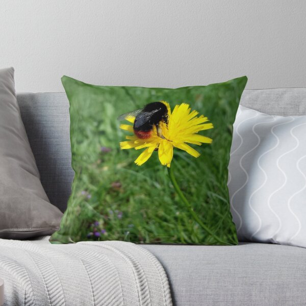 Bee on yellow flower Throw Pillow