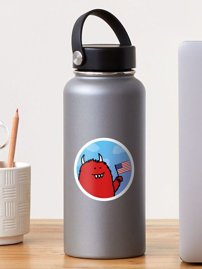 Thumbnail 1 of 3, Sticker, Celebratory Red Monster with Flag designed and sold by cartoongoddess.