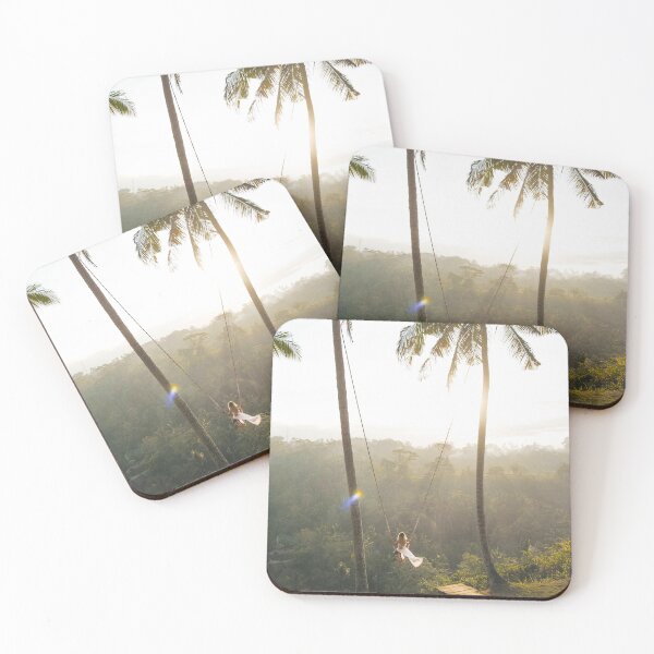 Item preview, Photograph of a swing set in the nature of Bali with green palmtrees  designed and sold by KIKAIA  The Label.