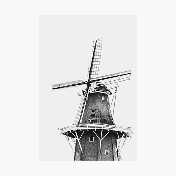 A black and white photo of a Dutch windmill in The Netherlands Photographic Print