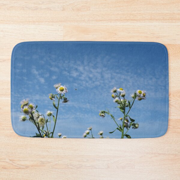 Item preview, Cirrocumulus clouds in blue sky; sunny peaceful spring day. Bee is coming to white and yellow flowers to pollinate. Water in a gaseous state in nature. The atmosphere of the earth. Symbol of freedom designed and sold by Maurizio Fabbroni.