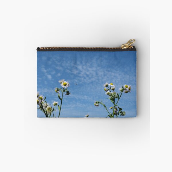 Item preview, Cirrocumulus clouds in blue sky; sunny peaceful spring day. Bee is coming to white and yellow flowers to pollinate. Water in a gaseous state in nature. The atmosphere of the earth. Symbol of freedom designed and sold by Maurizio Fabbroni.