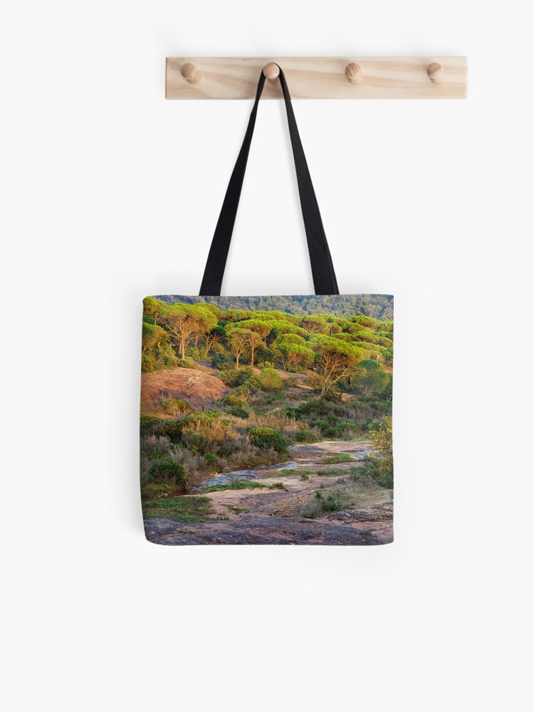 Thumbnail 1 of 2, Tote Bag, Parasol pines forest under the sunset light designed and sold by patmo.