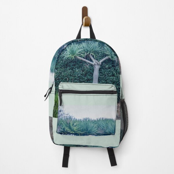 Item preview, dragon trees against green hedge designed and sold by Brian Scantlebury.