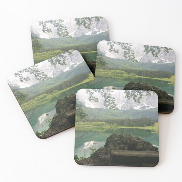 Item preview, A static shot from the shore of Fusine lake in the Julian Alps with snowy mountains in background and a bench. Beautiful nature in a spring cloudy day; no people around. Italy designed and sold by Maurizio Fabbroni.