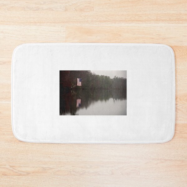 Item preview, An American Flag Hangs Over the Still Waters of Nashawannuck Pond In Late Autumn designed and sold by Stephen Orsillo.