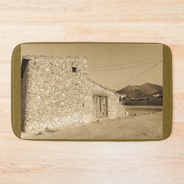 Item preview, Old stone building with dilapidated wooden doors designed and sold by Brian Scantlebury.
