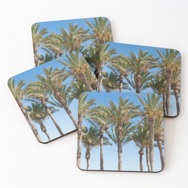 Item preview, Row of tropical feeling palm trees against blue sky with luch green fronds. designed and sold by Brian Scantlebury.