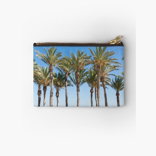 Item preview, Row of tropical feeling palm trees against blue sky with luch green fronds. designed and sold by Brian Scantlebury.