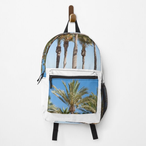 Item preview, Row of tropical feeling palm trees against blue sky with luch green fronds. designed and sold by Brian Scantlebury.