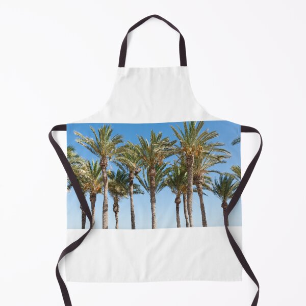 Item preview, Row of tropical feeling palm trees against blue sky with luch green fronds. designed and sold by Brian Scantlebury.