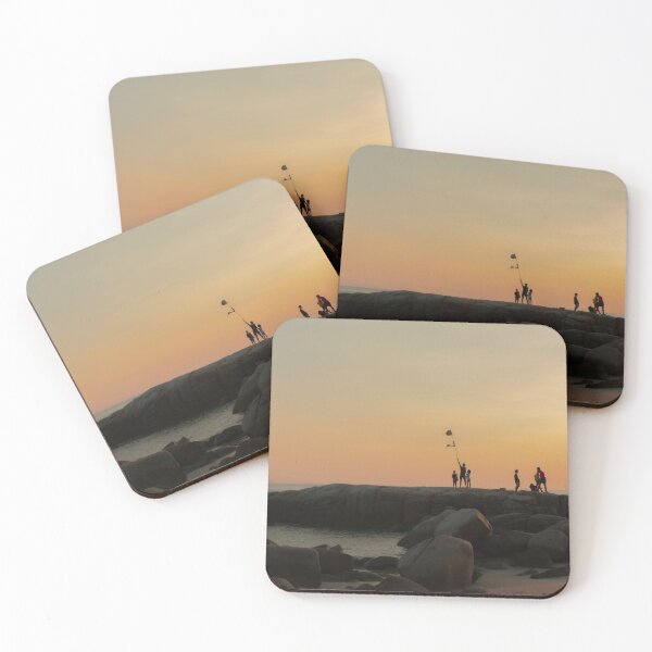 Item preview, The stones on beach in evening have the background of the sea and the evening sun. There are people standing on rocks and flags designed and sold by WP-7824.