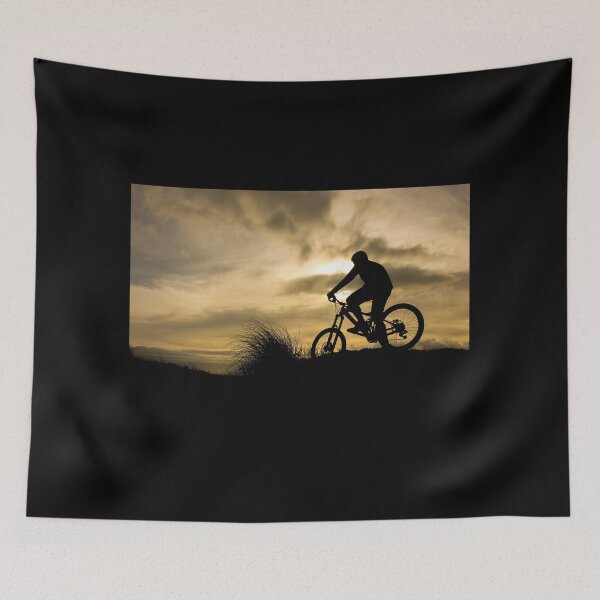 Item preview, Silhouette of a man on a bicycle in the sunset, clouds and plants in the background. designed and sold by AylaHarbich.