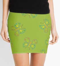 butterflies on green Mini Skirt