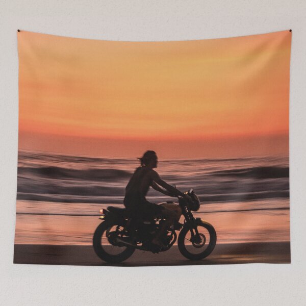 Item preview, Man Riding Bike on Beach during Sunset Classic T-Shirt designed and sold by pondemand.