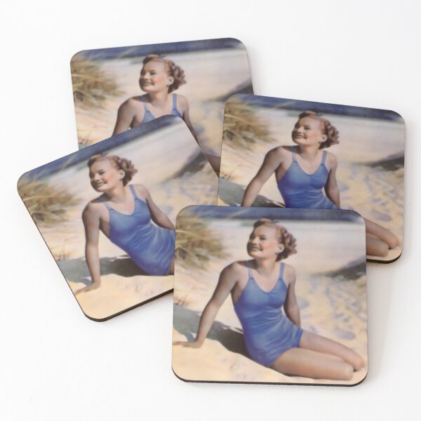 Item preview, 1940s Model in a blue swimsuit sitting on sand designed and sold by Lowtech.