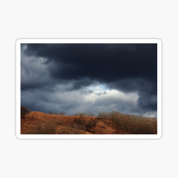 Gloomy storm clouds over the spring mountain Sticker