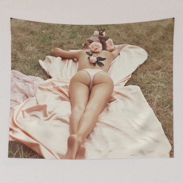 Item preview, Wall Art print MXI33173: Romantic young woman in underwear with long sexy legs lying half-naked on grass with pink flowers on her bare back designed and sold by MaximImages Exquisite Wall Art.
