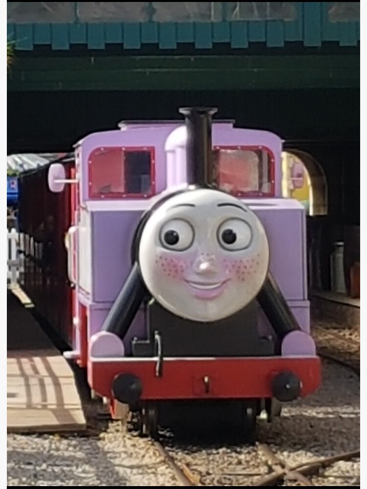 Rosie the pink Thomas the train on a wooden railroad Stock Photo