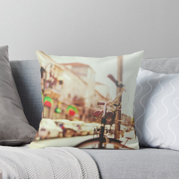 Item preview, Blurred image of city street with bicycle at sunset  designed and sold by dariazu.