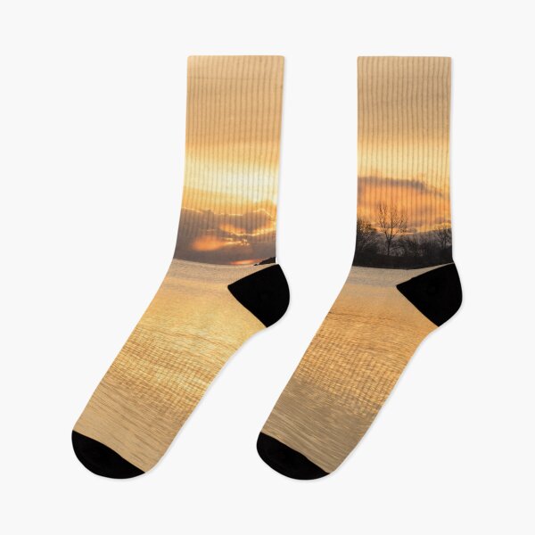 Item preview, Obscured Sunrise - Golden Rays Shining Through Openings in the Clouds designed and sold by Georgia Mizuleva.