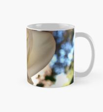 Ivory rose against the sky Mug