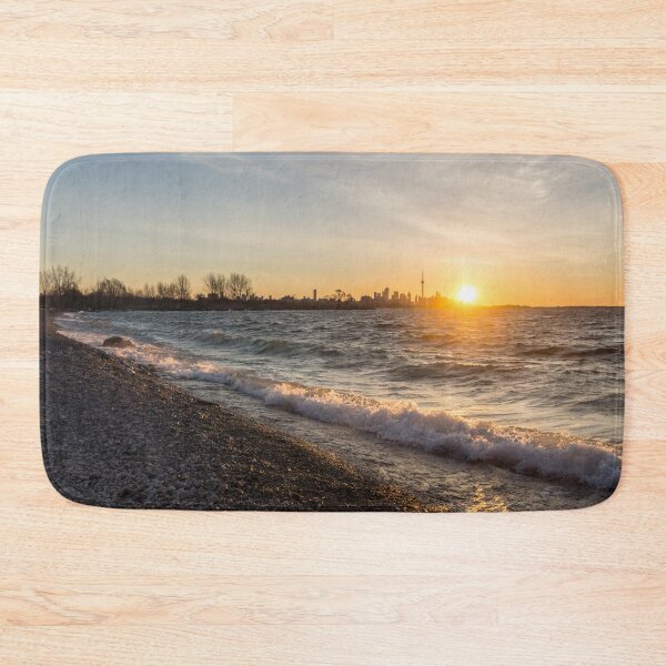 Item preview, Breaking Wave Sunrise - Toronto Skyline Behind Rough Lake Ontario designed and sold by Georgia Mizuleva.