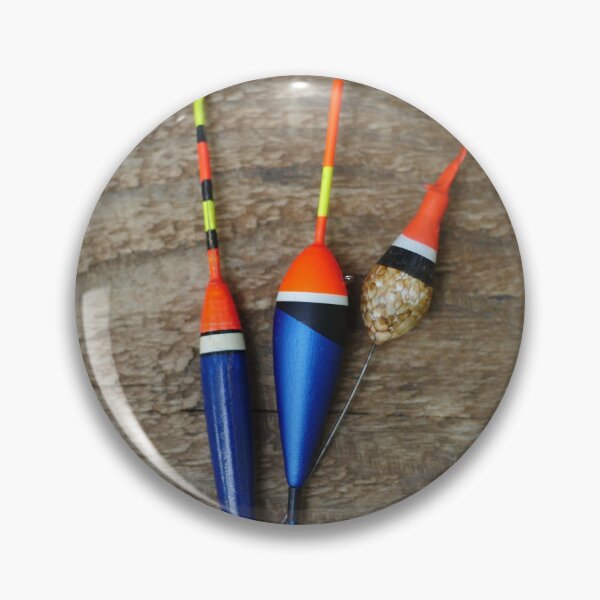 Item preview, three fishing bobbers on wooden background designed and sold by mrivserg.