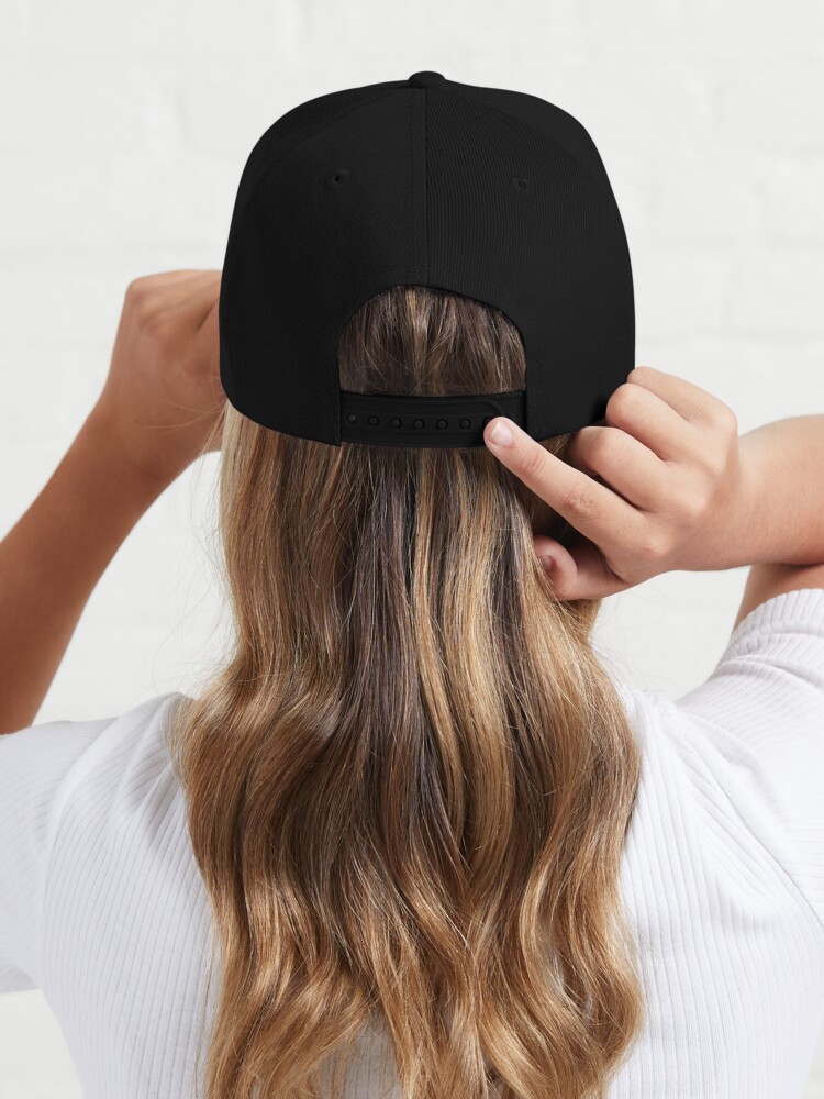 Rocking A Baseball Cap With Long Hair