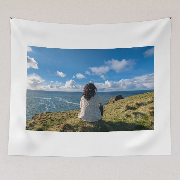 Item preview, The woman sits and enjoys ocean view from the Silver Strand in Malin Beg, near Glencolmcille, South West Donegal, Ireland designed and sold by AlbertMi.