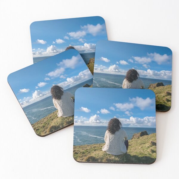 Item preview, The woman sits and enjoys ocean view from the Silver Strand in Malin Beg, near Glencolmcille, South West Donegal, Ireland designed and sold by AlbertMi.