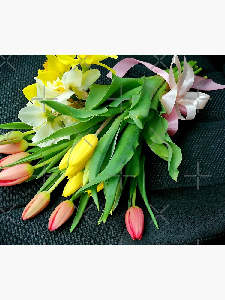 Bouquet of multicolored tulips, on the seat of a car, tied with a pink bow by CWartDesign