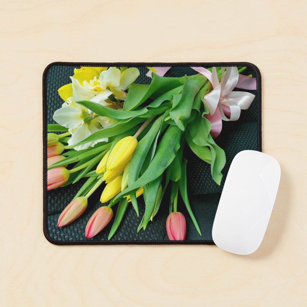 Bouquet of multicolored tulips, on the seat of a car, tied with a pink bow Mouse Pad