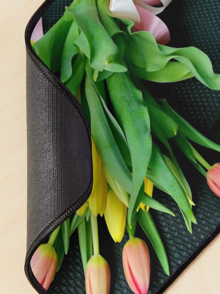 Alternate view of Bouquet of multicolored tulips, on the seat of a car, tied with a pink bow Mouse Pad