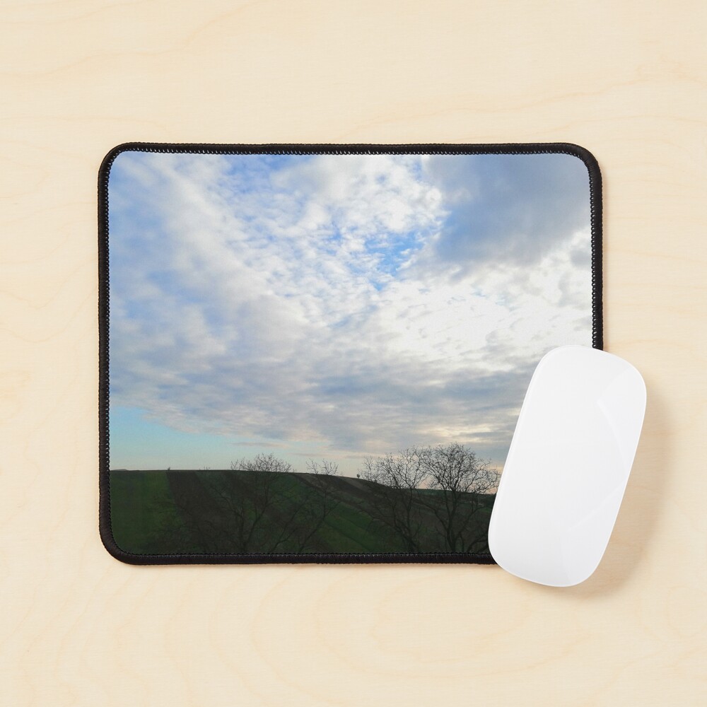 Mountain landscape at sunset, a few fluffy clouds and scattered skies in the sky, wonderful shades of colors Mouse Pad