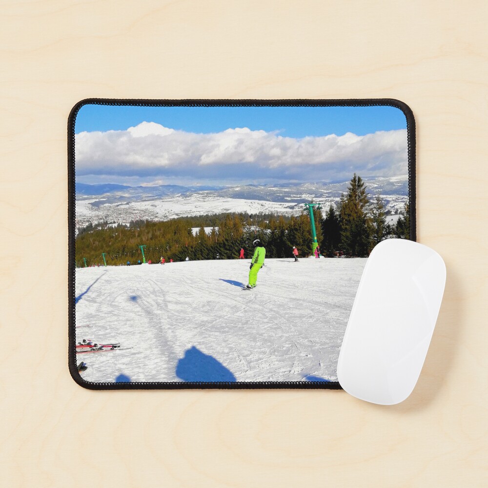 Landscape on the ski slope, sunny day, people feeling good, mountains in the distance, beautiful clouds in the sky Mouse Pad