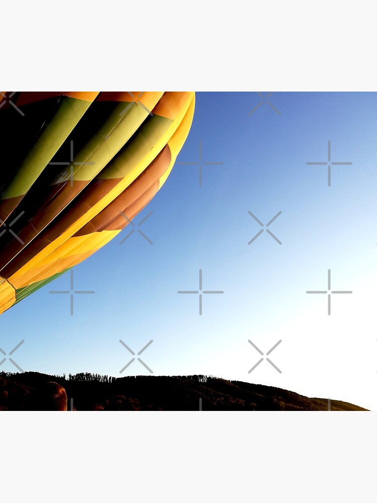 Colorful hot air balloon rising, sky without clouds, wonderful landscape by CWartDesign