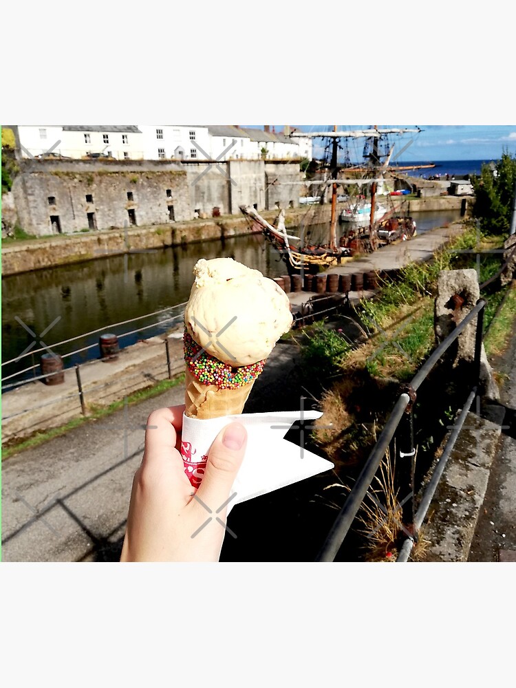 Person holding an ice cream cone near a sailboat and an old building, sunny day with clouds in the sky by CWartDesign