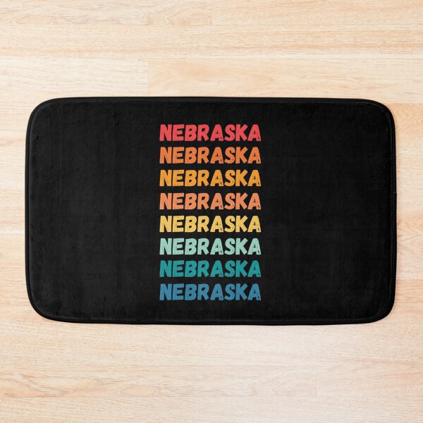 Item preview, NEBRASKA - repeated retro vintage sunset colors with a distressed design effect Graphic T-Shirt | Essential T-shirt designed and sold by printdot.