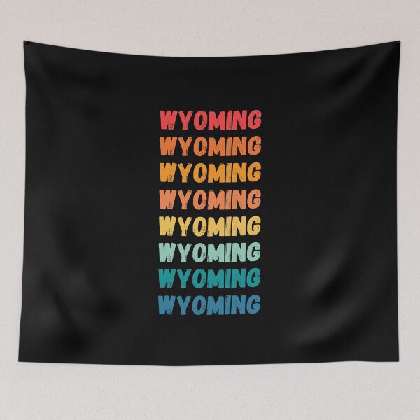 Item preview, WYOMING  - repeated retro vintage sunset colors with a distressed design effect Graphic T-Shirt | Essential T-shirt designed and sold by printdot.