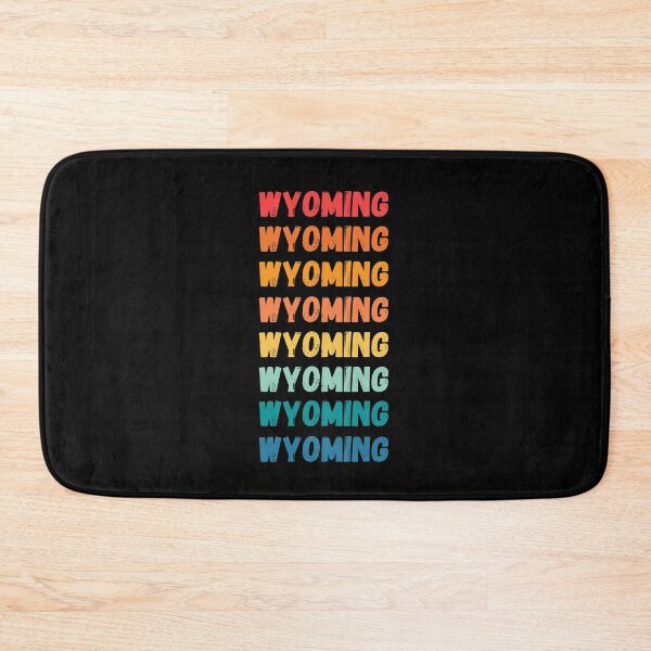 Item preview, WYOMING  - repeated retro vintage sunset colors with a distressed design effect Graphic T-Shirt | Essential T-shirt designed and sold by printdot.