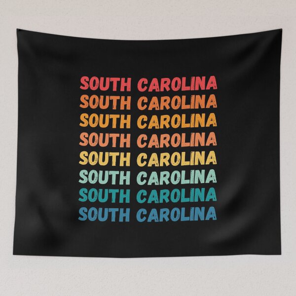 Item preview, SOUTH CAROLINA  - repeated retro vintage sunset colors with a distressed design effect Graphic T-Shirt | Essential T-shirt designed and sold by printdot.