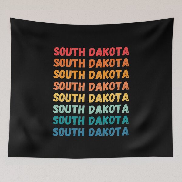 Item preview, SOUTH DAKOTA  - repeated retro vintage sunset colors with a distressed design effect Graphic T-Shirt | Essential T-shirt designed and sold by printdot.