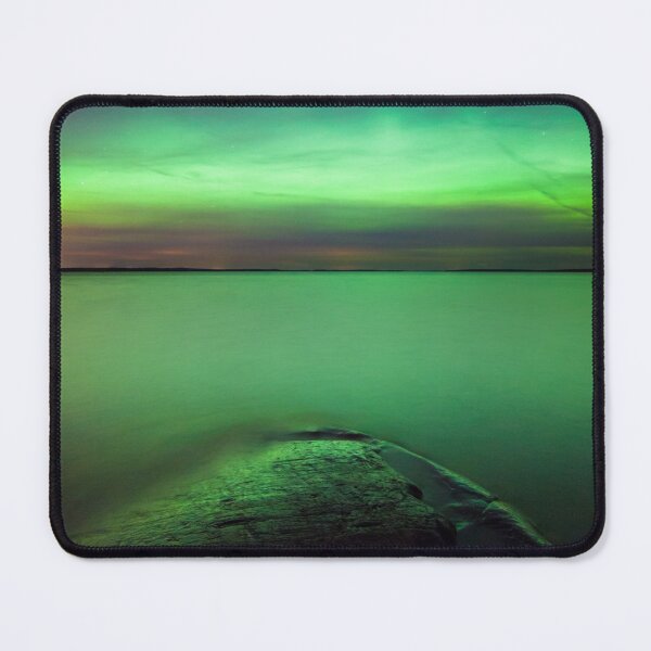 Northern lights glow over lake Mouse Pad