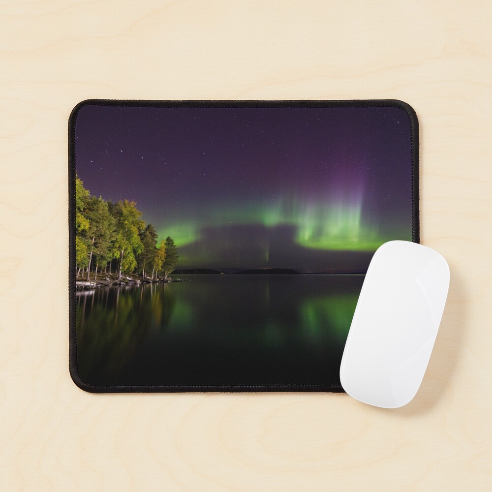 Northern lights glowing over lake in Finland Mouse Pad