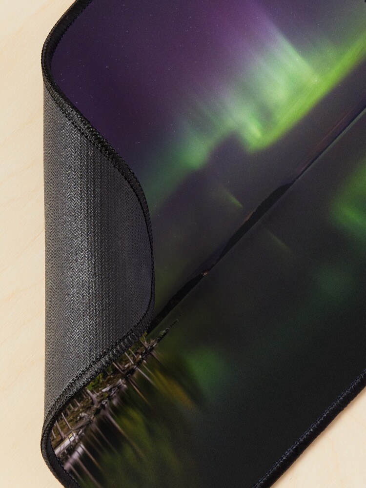 Alternate view of Northern lights glowing over lake in Finland Mouse Pad
