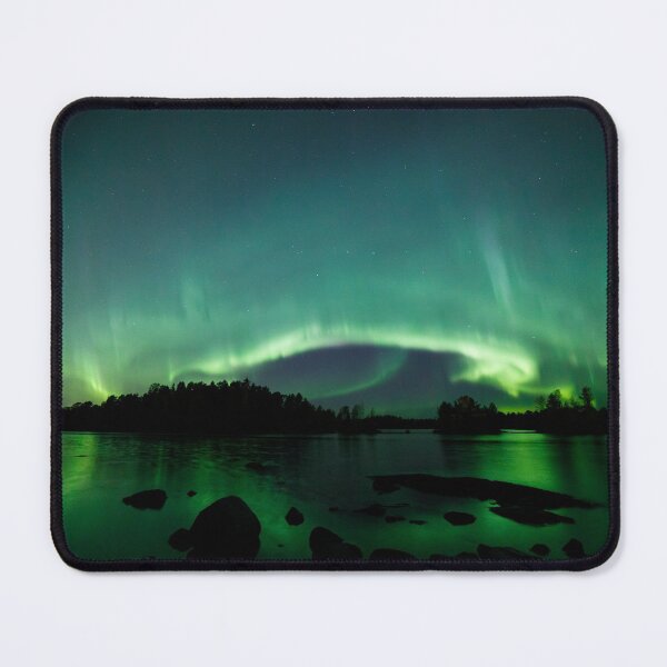 Beautiful northern lights over lake Mouse Pad